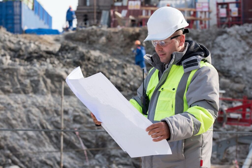 An engineer looking at the construction plan